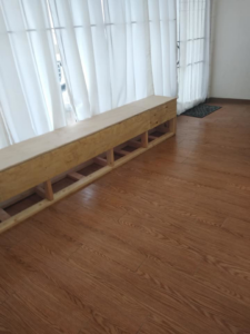 A custom wooden bench frame being installed as part of a handyman service by MG'S Services LLC in Albuquerque, NM.