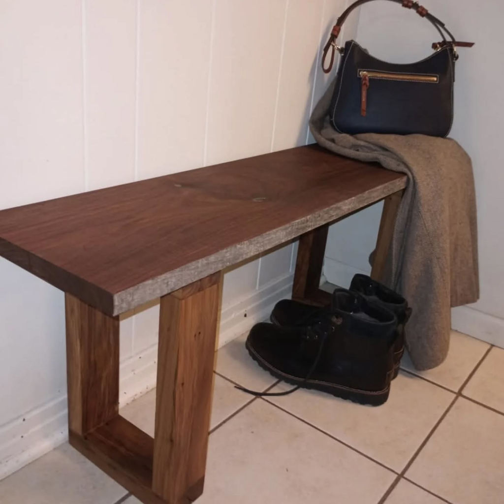 A custom-built wooden bench by Twenty-Three Roses Woodworks, perfect for an entryway in North Little Rock, AR.