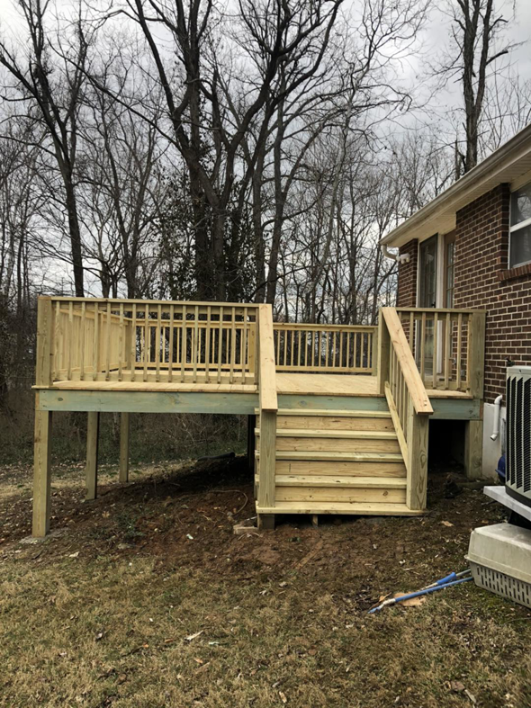 A custom wooden deck with stairs, recently installed by Brother George Remodeling & Construction in Louisville, KY.