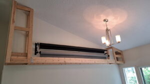 A custom wooden frame structure installed high on a wall, showcasing handyman installation services by Fix Idaho LLC in Meridian, ID.