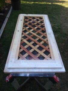 A custom wooden lattice panel being constructed on sawhorses by My Quality Handyman in Fresno, CA.