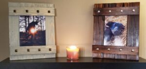 Two custom-made wooden picture frames with metal accents, crafted by Dovetails Services LLC in Derry, NH.