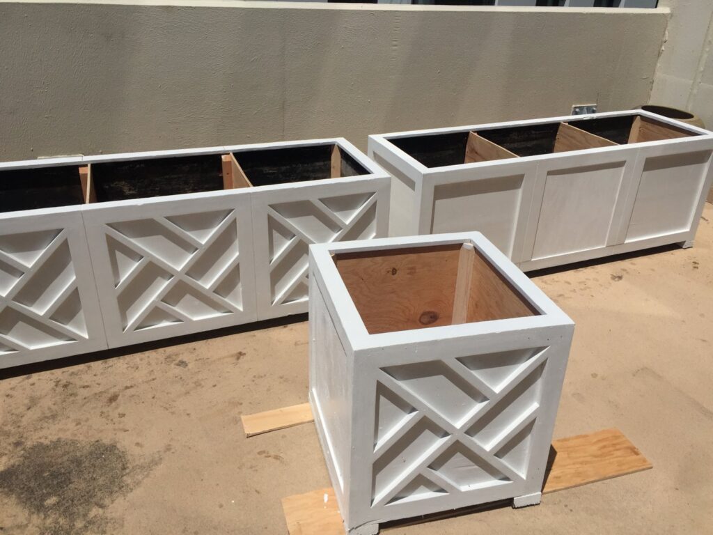 Custom-built wooden planters with a geometric design by Kennyman The Handyman Inc. in San Francisco, CA