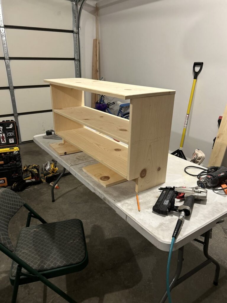 A custom wooden shelf unit under construction with tools, a service by Rockin & Rollin Handyman Services in North Ogden, UT.