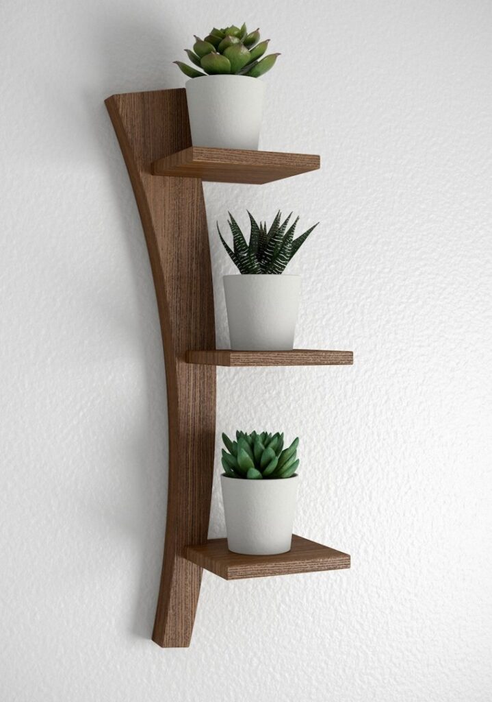 A custom-built and installed wooden wall shelf with three tiers, a service by Dovetails Services LLC in Derry, NH.