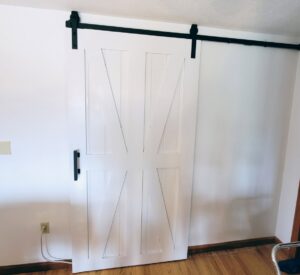 A custom woodworking project, possibly a furniture component, in progress in a workshop by Dovetails Services LLC in Derry, NH.