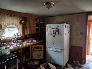 Severely damaged basement stairs requiring restoration or repair by J-BO Enterprises, Inc in Wilmington, MA.