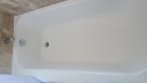 Before and after of a damaged clawfoot bathtub refinishing by Bath Refinishing Solutions Dayton in Dayton, OH