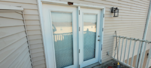 Exterior double door frame with significant wood rot and damage, requiring repair by Ray's Property Services in Johnson City, TN