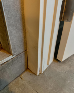 A damaged door frame showing cracks, ready for repair by Syd's Handyman Services in Oxnard, CA.