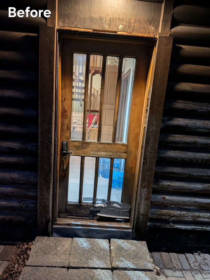 A damaged exterior wooden door on a log cabin before replacement by All Trades Home Improvement in Hobart, IN.