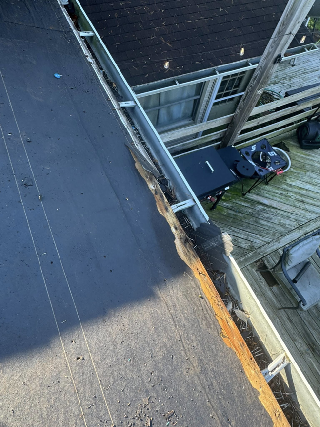 A close-up view of a damaged gutter and fascia board, indicating a repair job by Conway's Roofing in Richmond, KY.