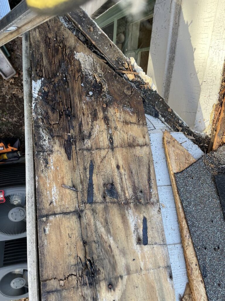 Severely damaged roof decking with visible rot and water damage, requiring repair by BLC Roofing in Akron, OH