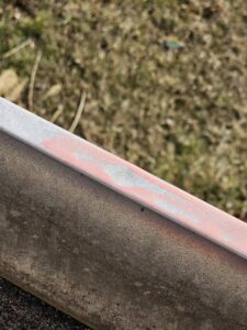 Close-up of damaged siding or trim, indicating repair services by Urban Restoration, LLC in Indianapolis, IN