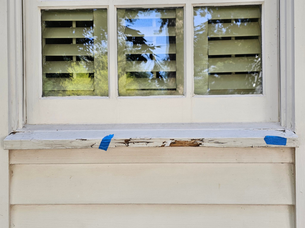 Close-up of a damaged window sill needing repair by KTL Home Repair and Remodeling in Norman, OK