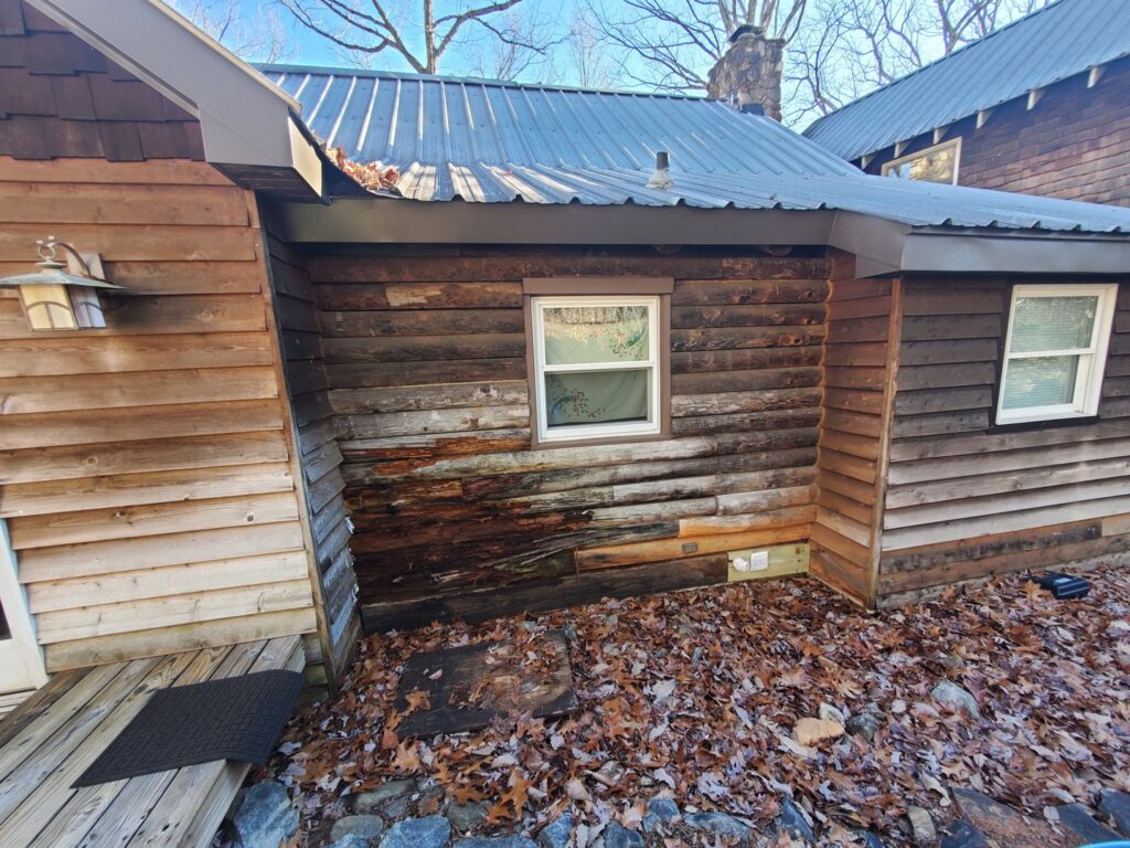 Exterior of a house showing damaged and rotting wood siding, indicating a repair job by GCI Services, Inc. in Simpsonville, SC