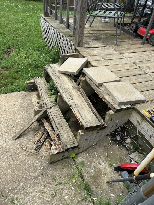 Severely damaged and broken wooden deck stairs needing repair or replacement by A2 Construction in Louisville, KY.