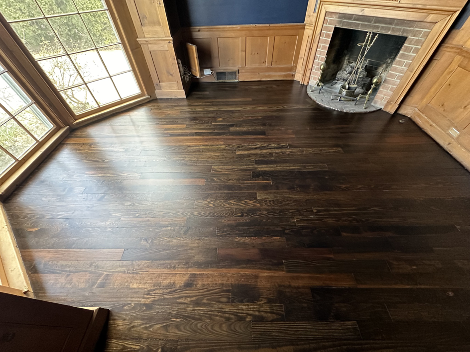 Dark wood floor refinishing completed by Sandman Wood Floor Refinishing in Cleveland, OH.