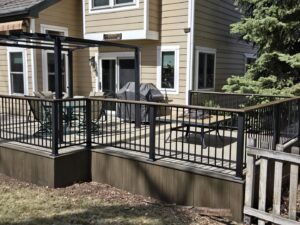 A beautiful deck and pergola installation with outdoor furniture by Lnk Deck & Remodels, LLC in Aurora, CO.