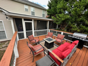 An inviting outdoor living space featuring a deck and screened-in porch by Music City Home Experience in Nashville, TN.