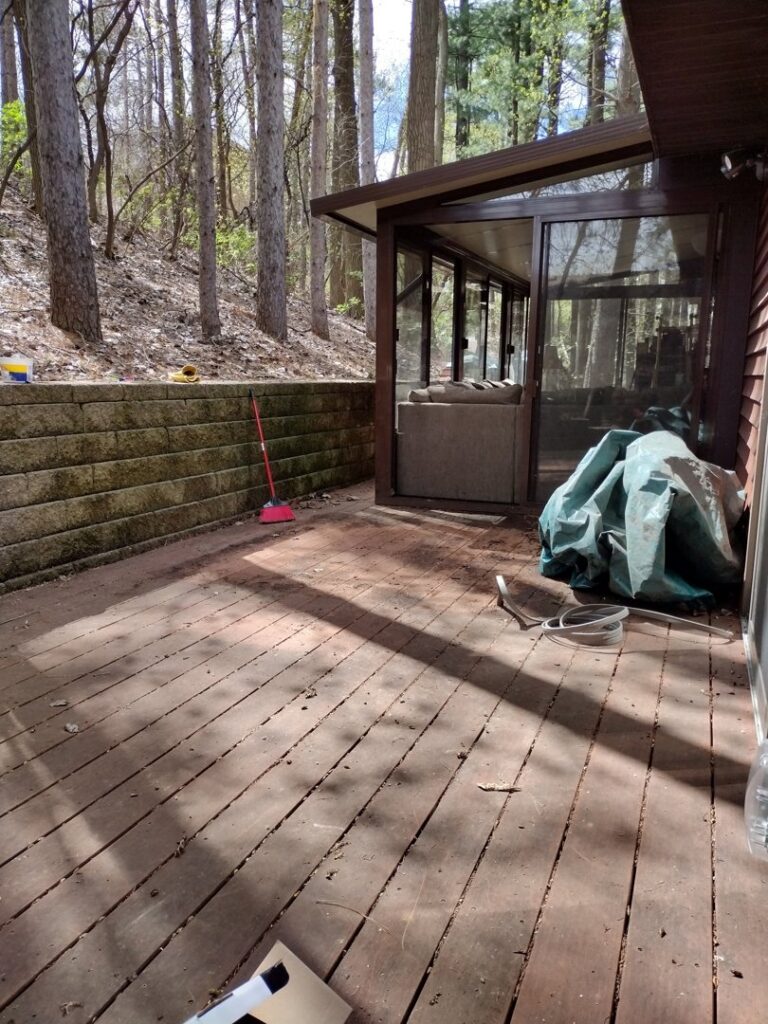 A wooden deck cleared of a broken hot tub after junk removal service by One Call Junk Removal in Minneapolis, MN