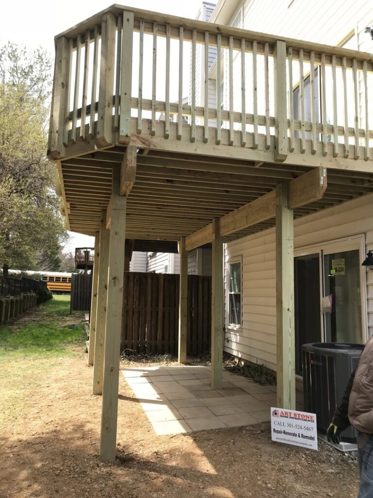 A wooden deck under construction, showing the sturdy support structure built by Artstone Exteriors & Renovations in Myersville, MD.