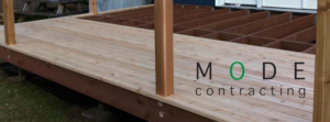 A wooden deck under construction, showcasing handyman services by Mode Contracting in Seattle, WA.