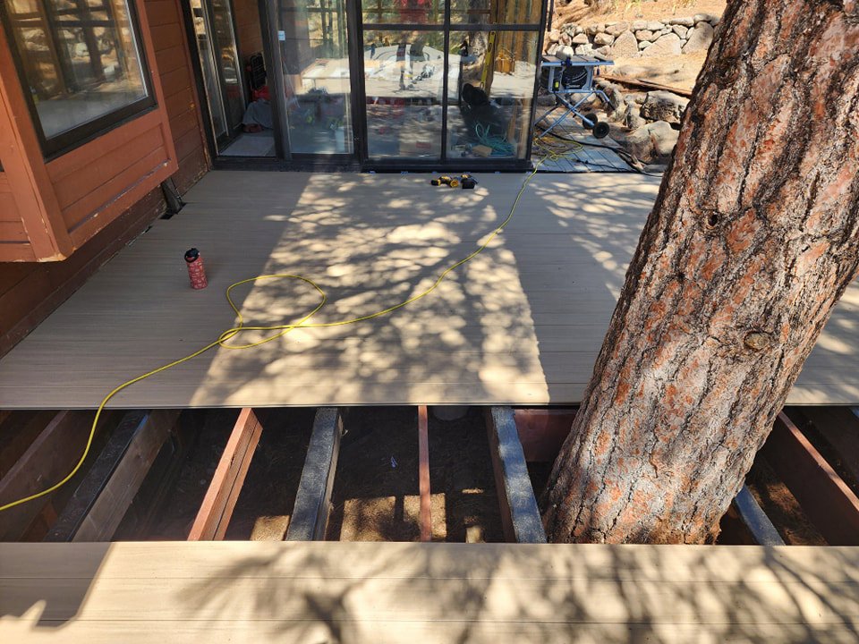 Ongoing deck construction with new composite decking being installed, a project by Tillman's Handyman Service in Sparks, NV.