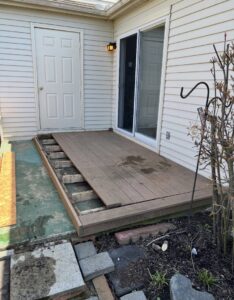 Partially disassembled deck boards and construction debris, indicating a demolition and junk removal job by Vatter Hauling Service in Lancaster, PA.