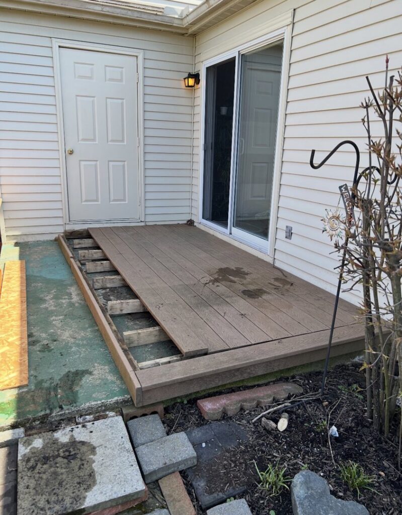Partially disassembled deck boards and construction debris, indicating a demolition and junk removal job by Vatter Hauling Service in Lancaster, PA.