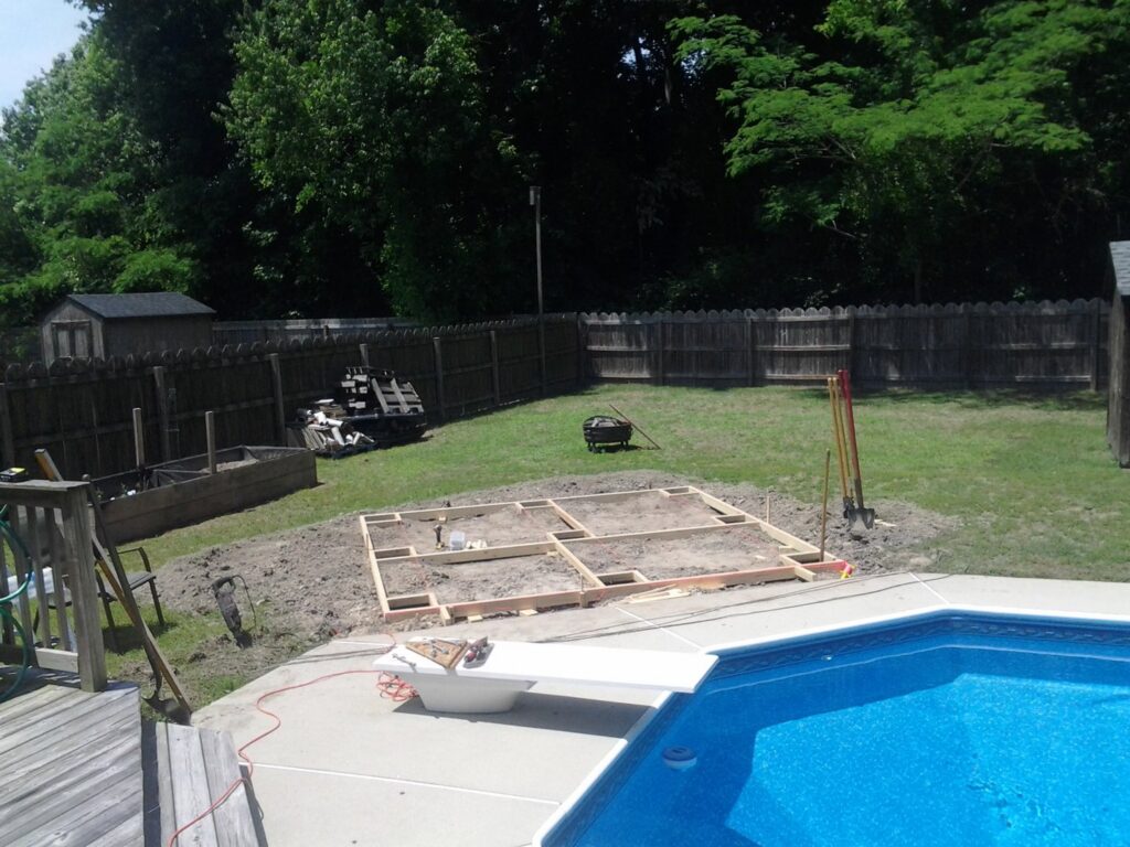 Wooden foundation framing for a new deck or outdoor structure being laid by The Home Pros in Virginia Beach, VA