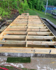 Wooden deck framing under construction, showing new lumber joists, by Yellow Ladder Contracting in Mount Pleasant, SC
