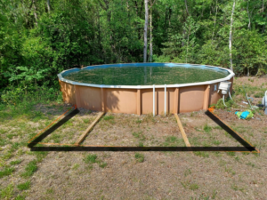 Wooden framing laid out for a new deck around an above-ground pool by Donald Home Improvements, llc in Milford, DE.