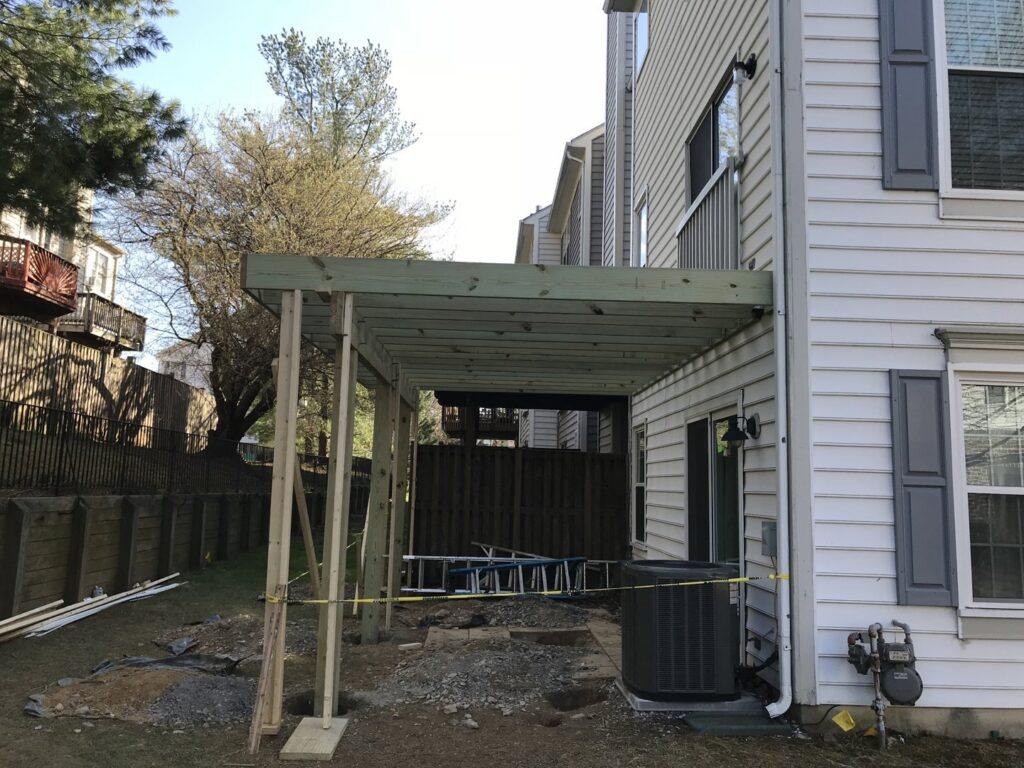 The framing of a new deck being installed, a construction project by Artstone Exteriors & Renovations in Myersville, MD.