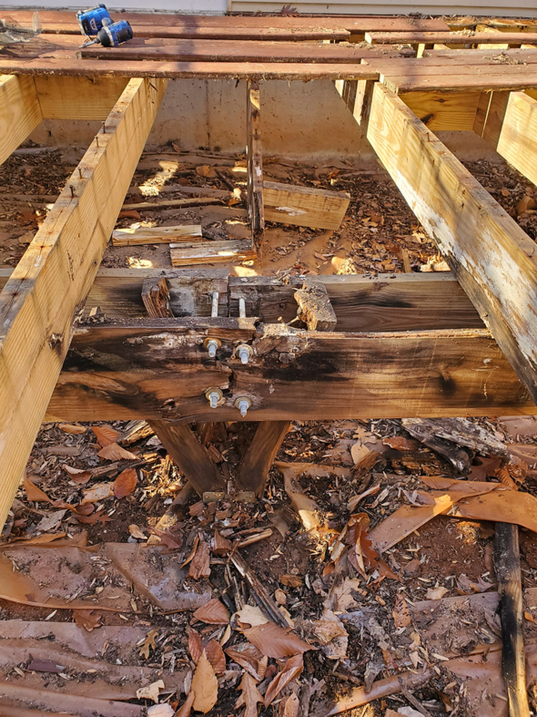 Close-up of deck framing and structural repair work in progress by Handyman Hal in Wilmington, DE.