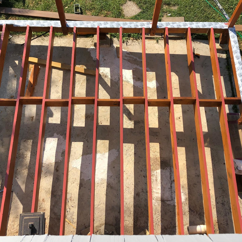 Wooden framing and joists for a deck or floor structure by Surtec Remodeling Inc. in Pittsburgh, PA.