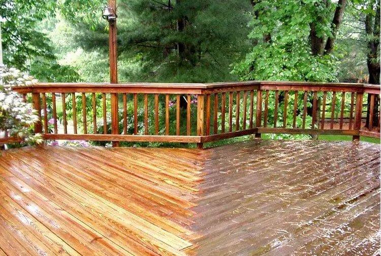 Deck power washing in progress, showing a clear difference, by Total Powerwashing in Valley Park, MO.