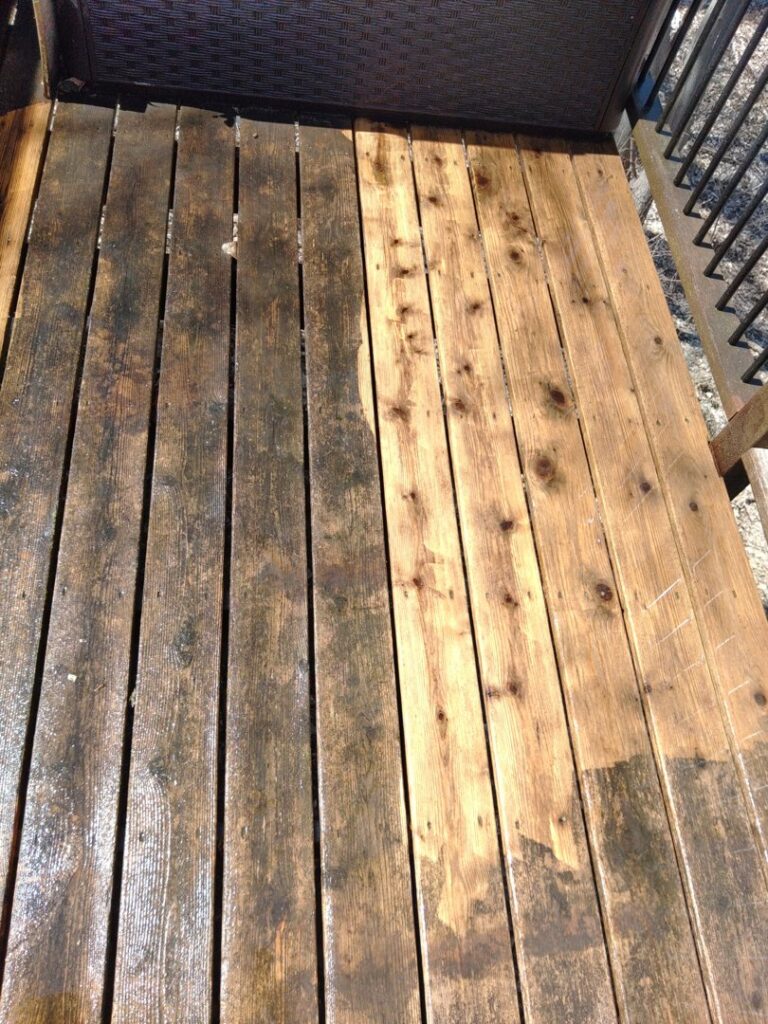 A wooden deck showing a clear before-and-after of pressure washing by IFixdIt Handyman Services in Omaha, NE.