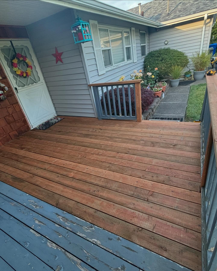 A wooden deck undergoing refinishing or staining, showcasing a handyman project by Full Throttle Remodel in Salem, OR.