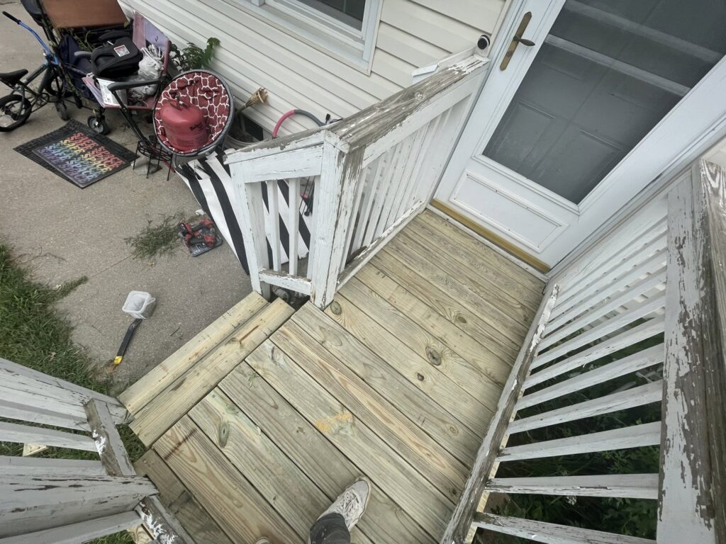 Wooden deck repair and resurfacing in progress with new planks installed by CJP Construction handyman services in Pierce, NE.