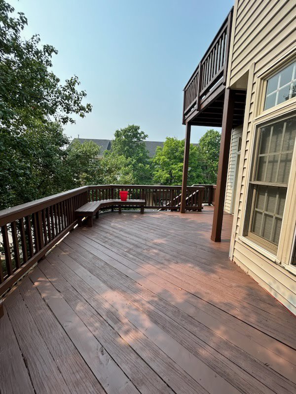 A freshly stained or maintained outdoor deck, a service offered by Quality Services, LLC in Alexandria, VA.