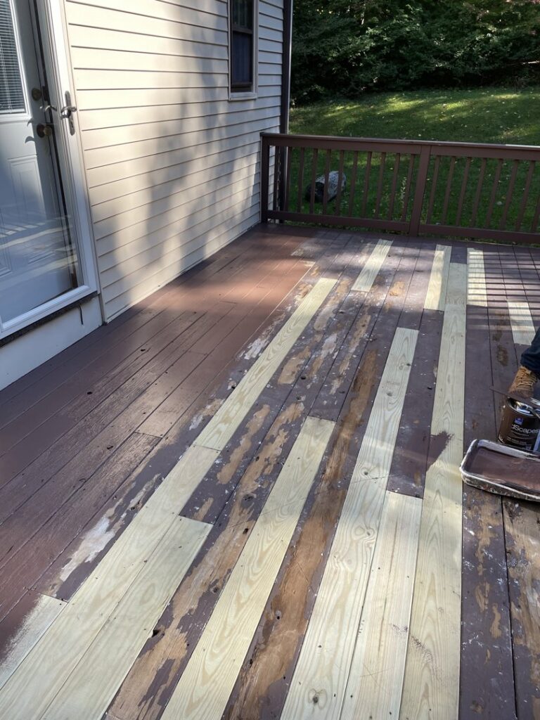 Wooden deck staining and painting in progress by JAC Home Improvement LLC in Danbury, CT.