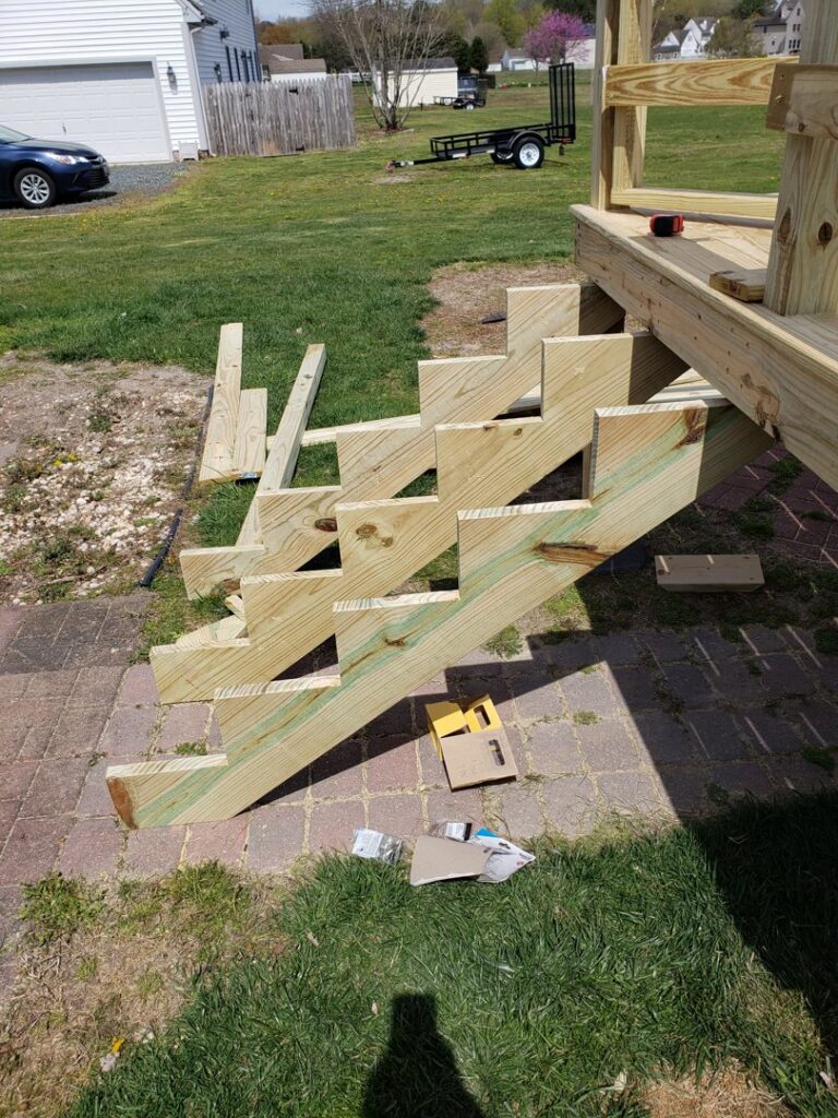 Wooden deck stairs under construction by Priority Property Services in Salisbury, MD.