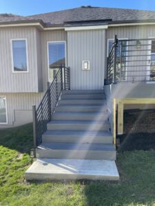 Newly installed deck stairs with modern railings by Chad Fry the Deck Guy LLC in Blue Springs, MO.