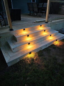 Newly installed deck stairs featuring modern integrated lighting, enhancing safety and ambiance by Midwest Home Remodeling & Design LLC in Chicago, IL.