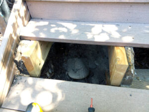 Exposed wooden supports under a deck step, indicating repair or construction work by Boise Handyman & Remodel in Boise, ID.