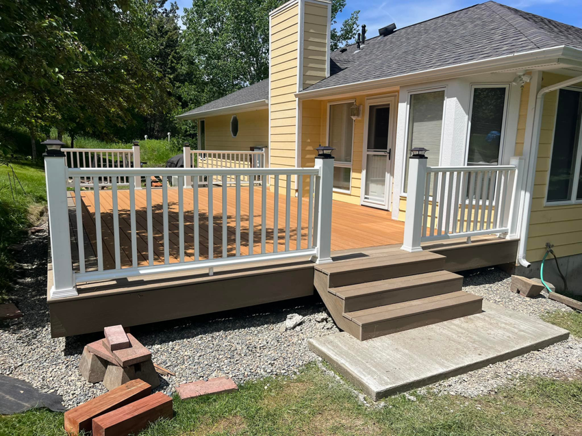 Another view of a newly built outdoor deck with steps by Royal Construction & Remodeling, Inc. in Lake Charles, LA.