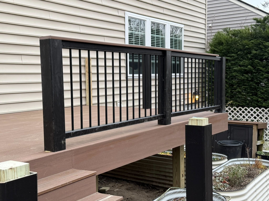 Newly installed deck steps and railing system by Harris Home Creations, a general contractor in Philadelphia, PA.