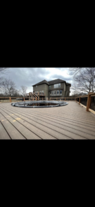 Detailed view of the deck surface and seamless pool integration by Chad Fry the Deck Guy LLC in Blue Springs, MO.