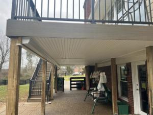 The underside of a newly built deck showing support structure and ceiling by Decks Unlimited in Littleton, CO.